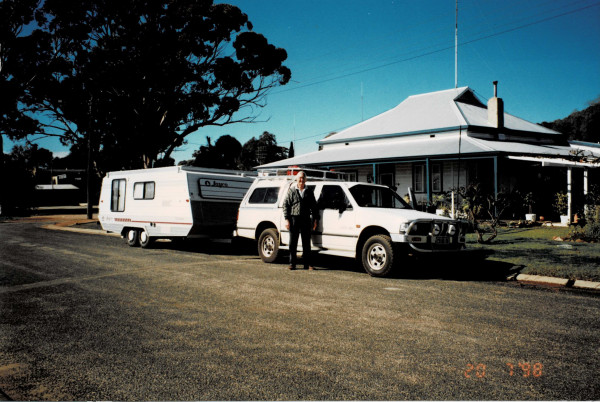 Frank Lewis next to his caravan